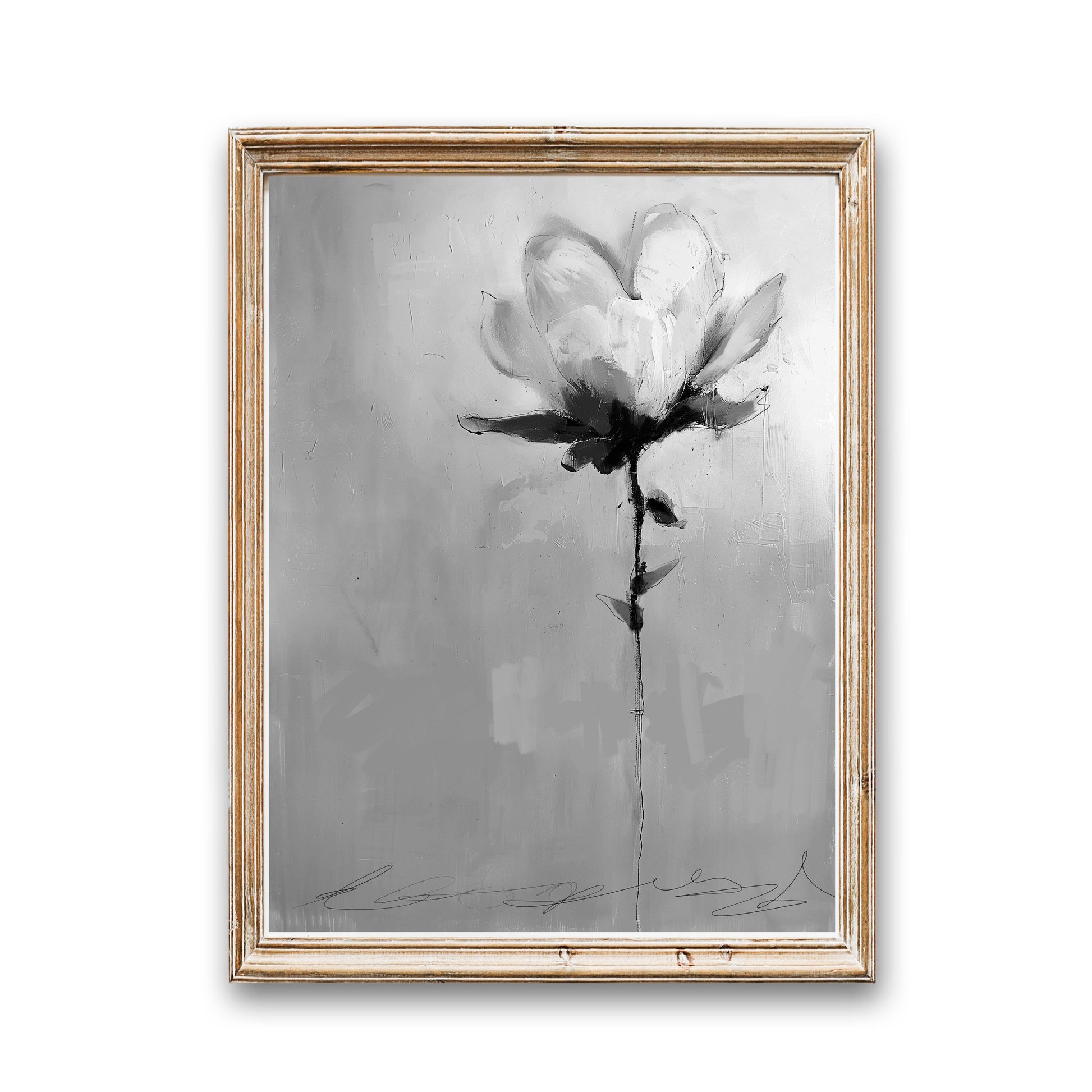 A framed grayscale painting of a single flower. The flower is rendered in a loose, expressive style with shades of gray and white. The background is a textured gray canvas. The painting is in a light beige wooden frame.  The artist's signature is visible at the bottom. The overall style is modern and abstract.